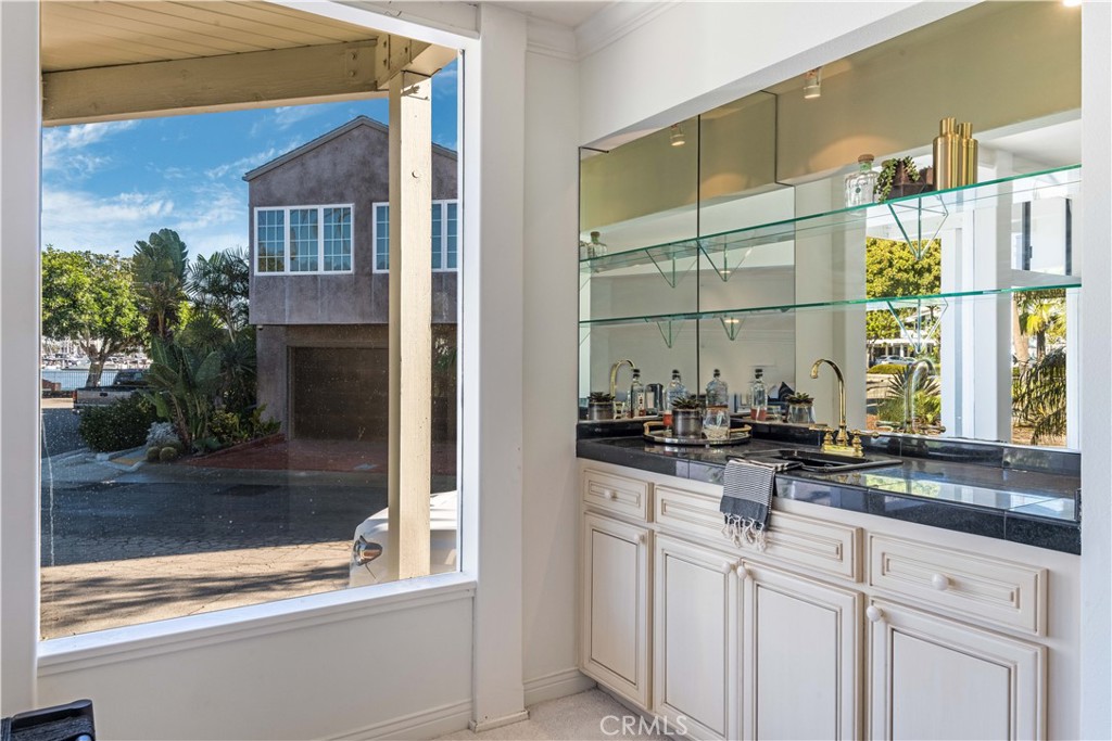 6090 Appian Way Long Beach, CA 90803 - Photo 8 of 41 a kitchen with stainless steel appliances a sink and a window