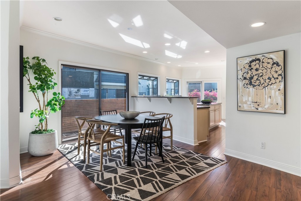 6090 Appian Way Long Beach, CA 90803 - Photo 9 of 41 a view of a dining room with furniture and wooden floor