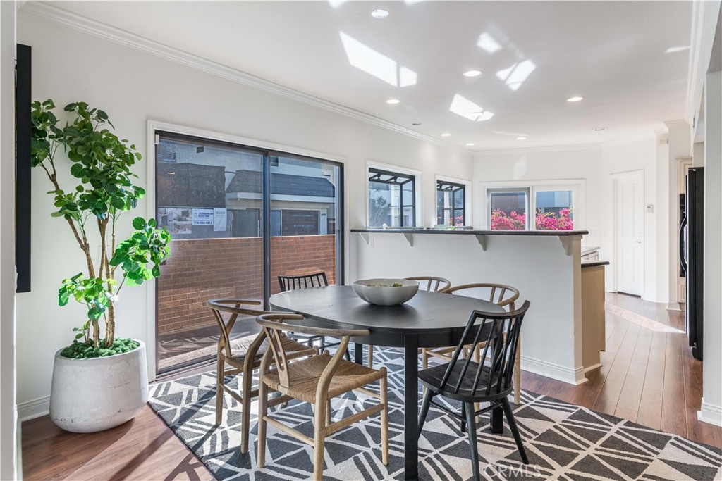 6090 Appian Way Long Beach, CA 90803 - Photo 10 of 41 a view of a dining room with furniture and a potted plant
