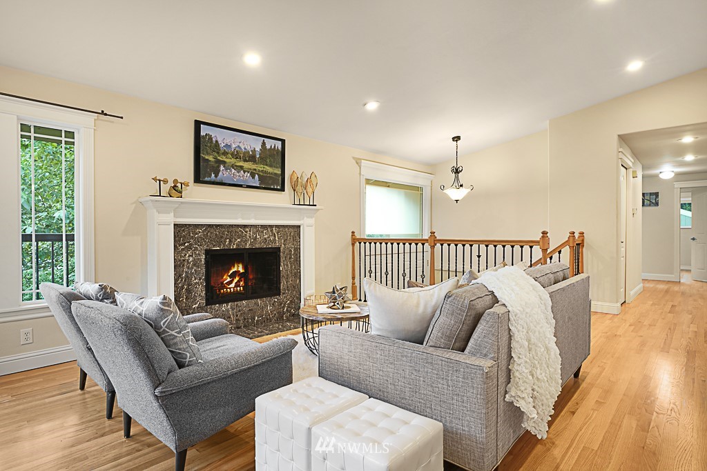 2806 183rd Avenue Northeast Redmond, WA 98052 - Photo 11 of 40 a living room with furniture and a fireplace