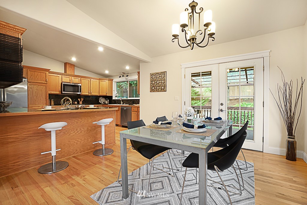 2806 183rd Avenue Northeast Redmond, WA 98052 - Photo 13 of 40 a view of a dining room with furniture window and wooden floor