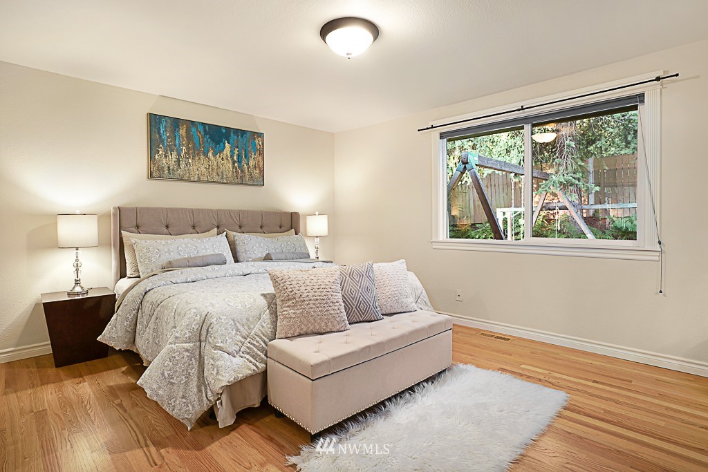 2806 183rd Avenue Northeast Redmond, WA 98052 - Photo 17 of 40 a bed room with a bed and a large window