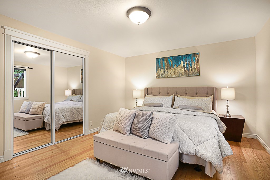 2806 183rd Avenue Northeast Redmond, WA 98052 - Photo 18 of 40 a bedroom with a bed and wooden floor