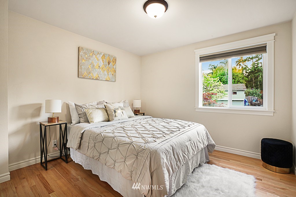 2806 183rd Avenue Northeast Redmond, WA 98052 - Photo 20 of 40 a bedroom with a bed and wooden floor
