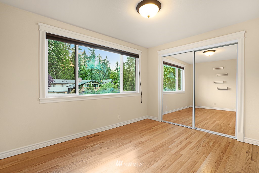 2806 183rd Avenue Northeast Redmond, WA 98052 - Photo 22 of 40 an empty room with wooden floor and windows