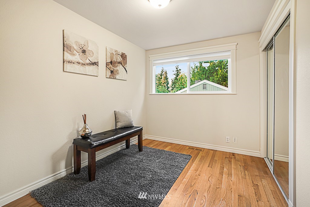 2806 183rd Avenue Northeast Redmond, WA 98052 - Photo 23 of 40 a room with a window and a wooden floor