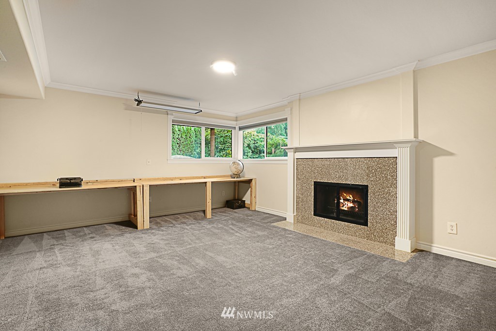 2806 183rd Avenue Northeast Redmond, WA 98052 - Photo 24 of 40 a view of an empty room with a fireplace and a window