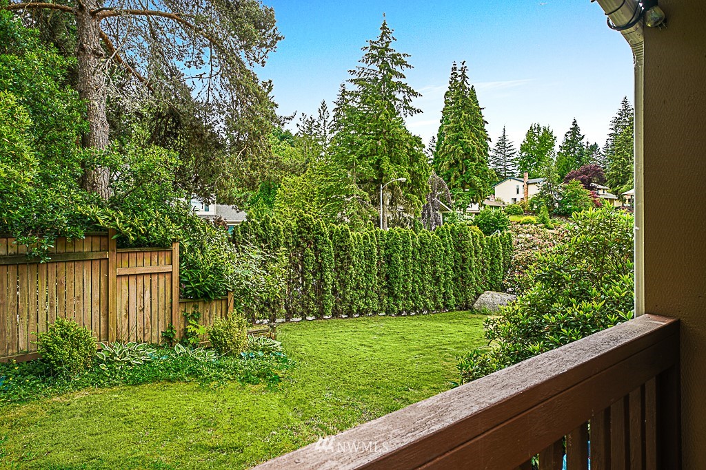 2806 183rd Avenue Northeast Redmond, WA 98052 - Photo 33 of 40 a view of a backyard with potted plants and wooden fence