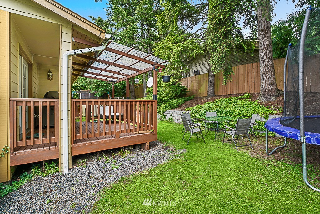 2806 183rd Avenue Northeast Redmond, WA 98052 - Photo 34 of 40 a view of a chair and table in backyard of the house