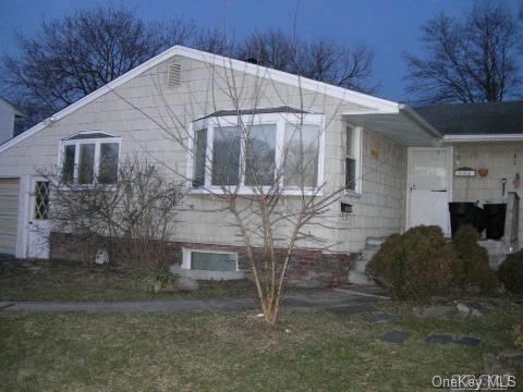 149 Tree Road Centereach, NY 11720 - Photo 1 of 1 a view of a house with a yard