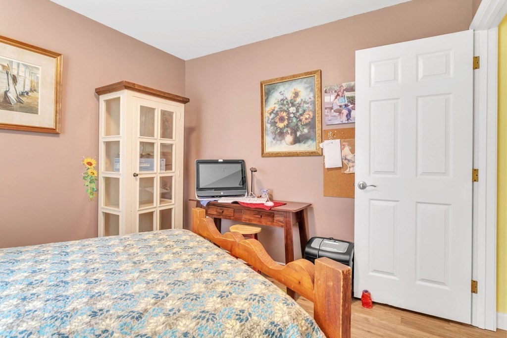 359 March Road Ashfield, MA 01370 - Photo 18 of 34 a bedroom with a bed and a flat screen tv