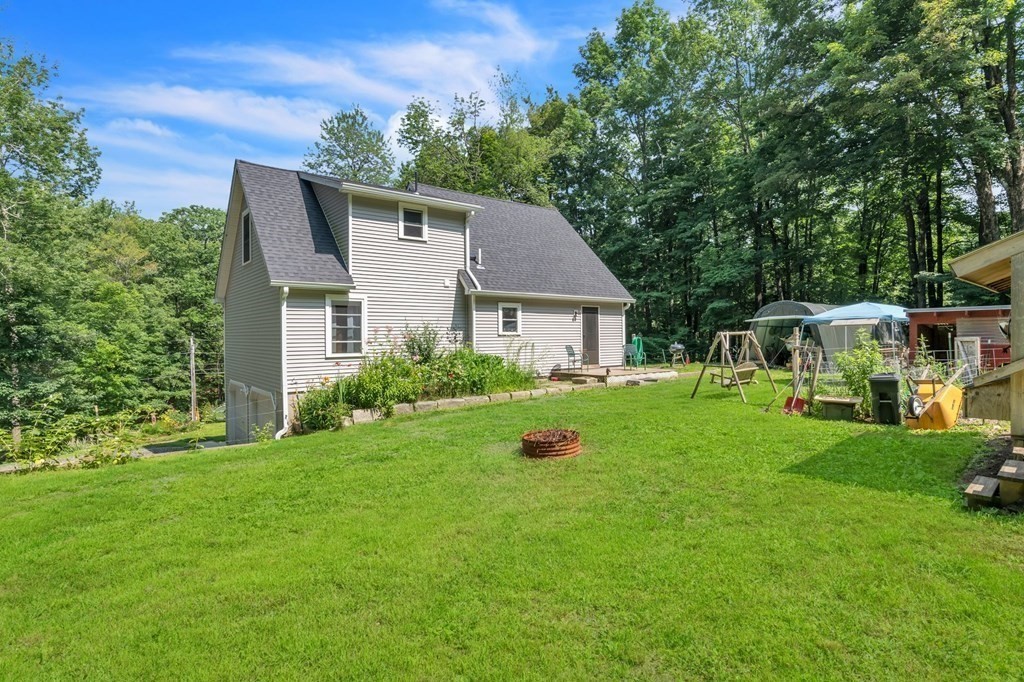 359 March Road Ashfield, MA 01370 - Photo 29 of 34 a front view of a house with garden