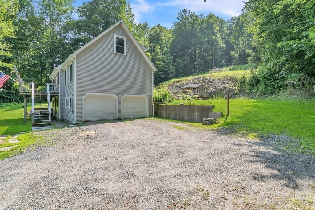 359 March Road Ashfield, MA 01370 - Photo 3 of 34 a backyard of a house with plants and trees