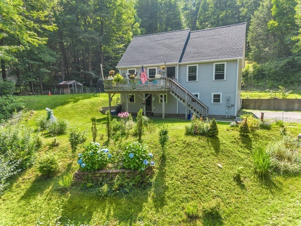 359 March Road Ashfield, MA 01370 - Photo 32 of 34 a aerial view of a house with swimming pool and garden