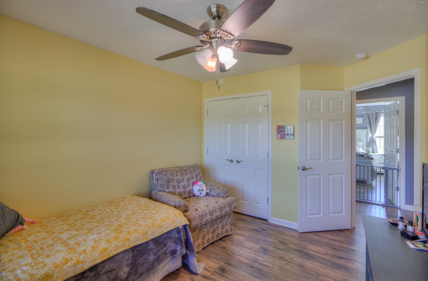 869 Jarrell Road Manchester, TN 37355 - Photo 17 of 33 a bedroom with a bed and a chandelier
