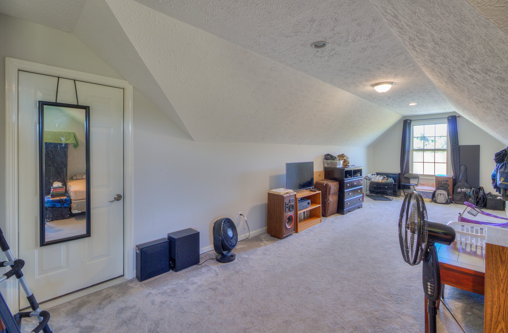 869 Jarrell Road Manchester, TN 37355 - Photo 22 of 33 a view of a livingroom with furniture and a ceiling fan