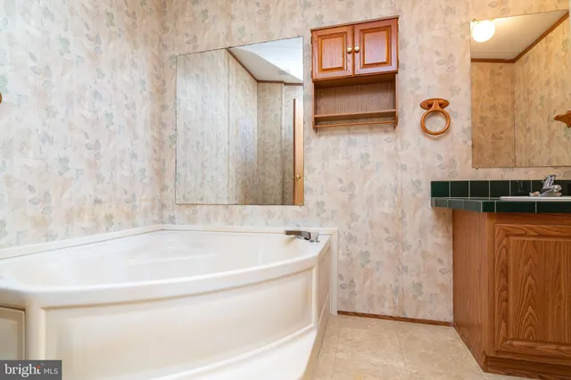 a bathroom with shower and bathtub
