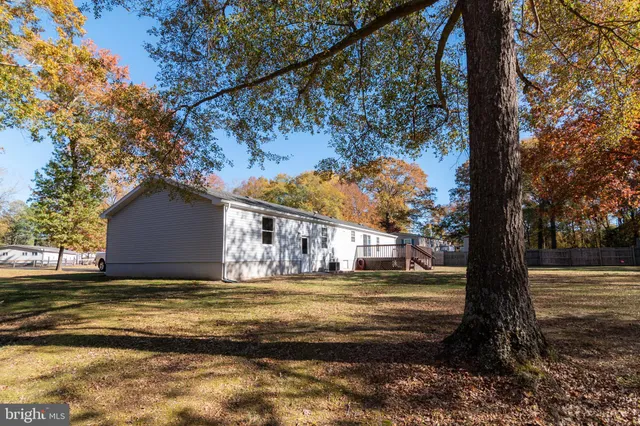 a view of balcony with wooden floor and fence