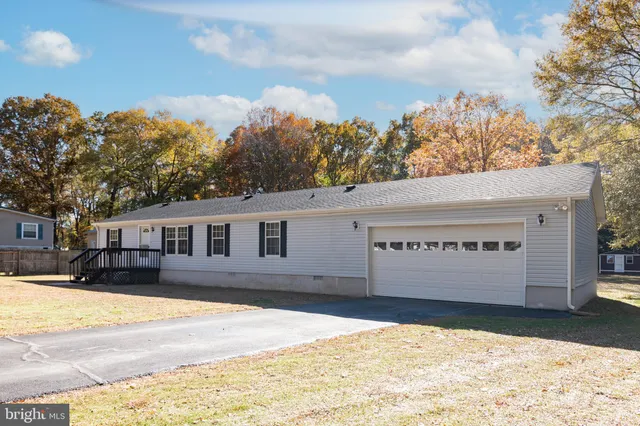 a view of the house with a yard