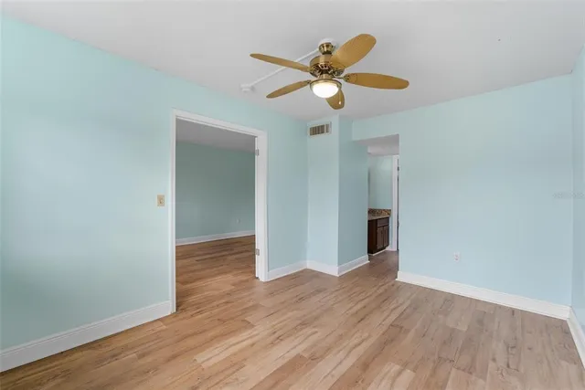 a bathroom with a granite countertop and sink