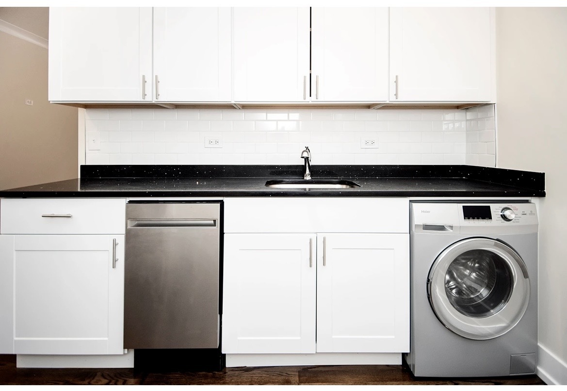 648 West Roscoe Street, Unit 2N Chicago, IL 60657 - Photo 6 of 12 a kitchen with a sink and a refrigerator