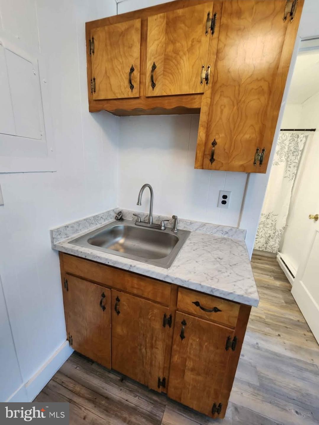 26530 Three Notch Road, Unit 1 Mechanicsville, MD 20659 - Photo 7 of 9 a sink with an umbrella