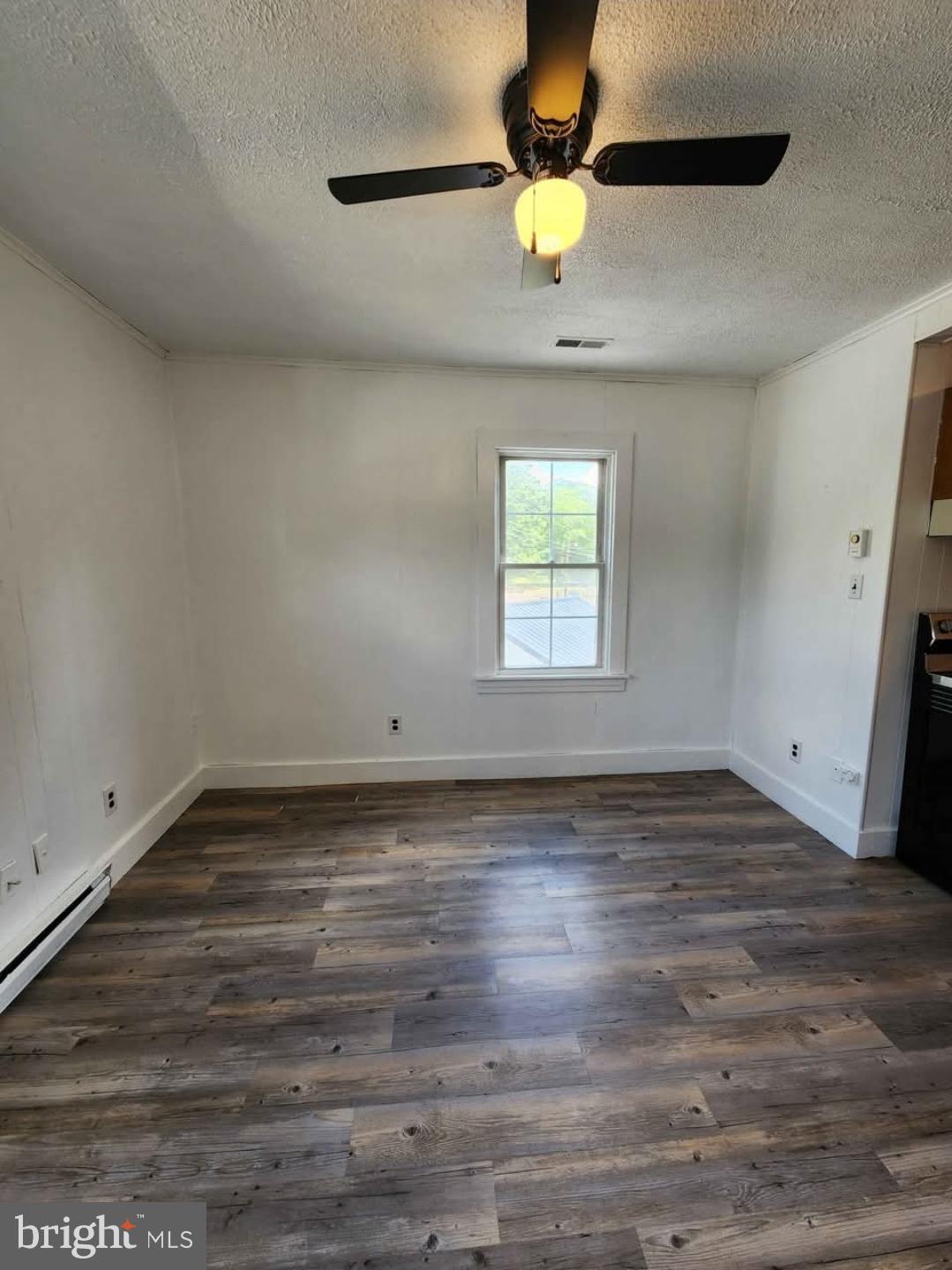 26530 Three Notch Road, Unit 1 Mechanicsville, MD 20659 - Photo 9 of 9 a view of empty room with wooden floor and window