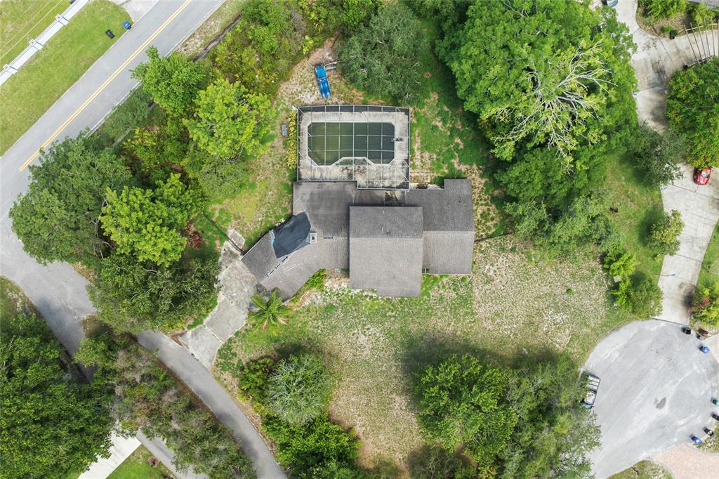 8735 Rancho Court Orlando, FL 32836 - Photo 2 of 4 an aerial view of a house with a yard
