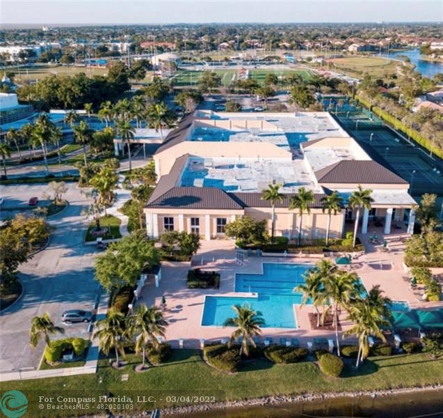 9537 Weldon Circle, Unit I308 Tamarac, FL 33321 - Photo 10 of 12 an aerial view of a house with yard swimming pool and outdoor seating