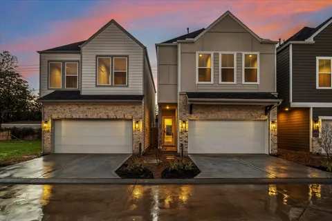 a front view of a house with garage