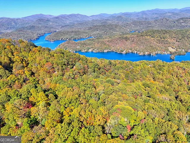 a view of an aerial view of residential house and sandy dunes