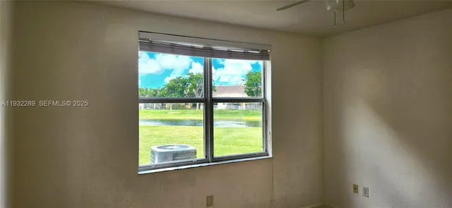 a view of a room that has a large window