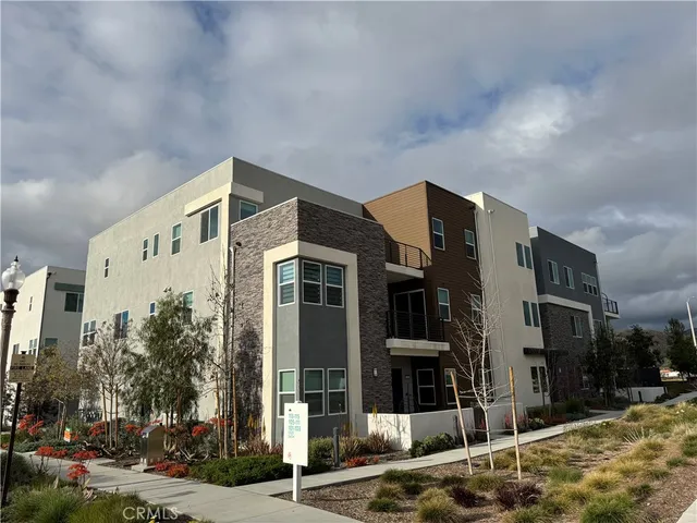 a front view of a building with street view