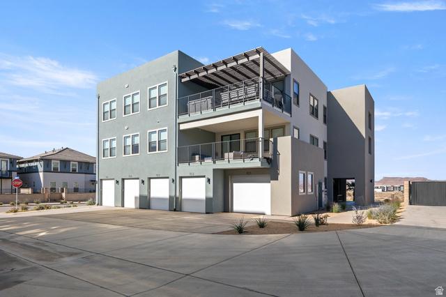 762 West Periwinkle Lane, Unit 102 St. George, UT 84790 - Photo 26 of 40 View of apartment building / complex with a garage and driveway