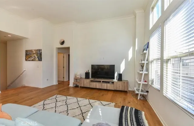 a view of living room with furniture and flat screen tv