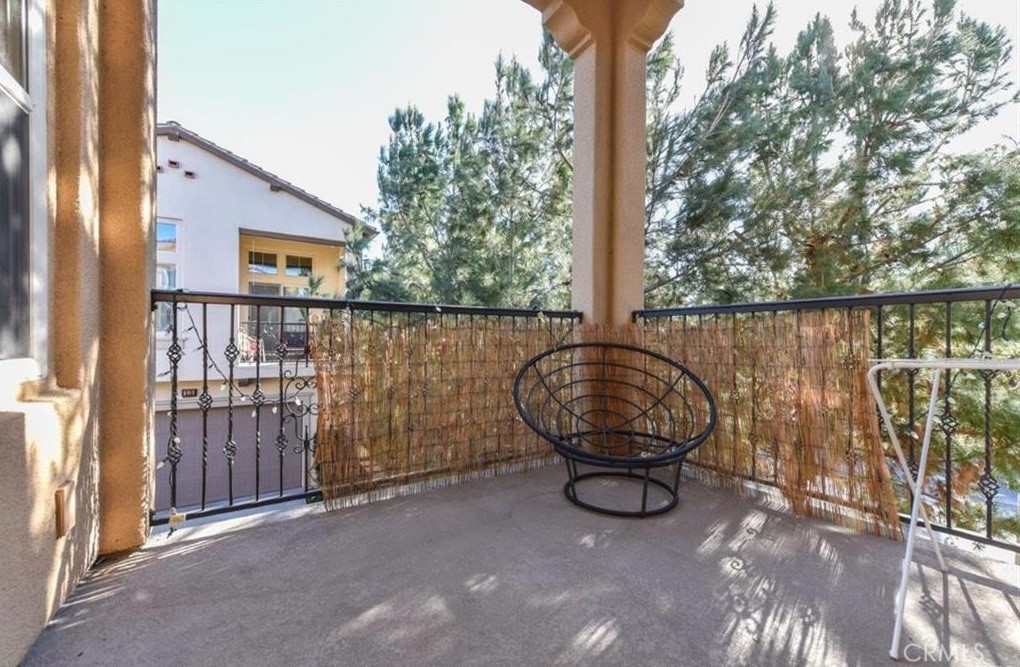 202 Kempton Irvine, CA 92620 - Photo 6 of 7 a view of balcony with wooden floor and outdoor seating