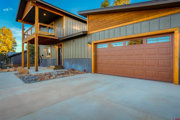 a open kitchen with stainless steel appliances granite countertop a sink stove and wooden floor