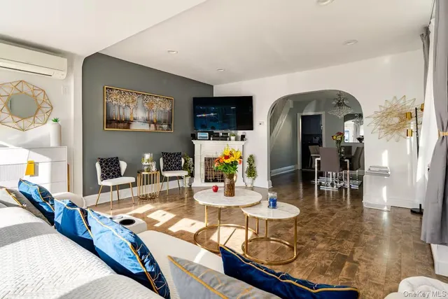 a living room with dining table and chairs