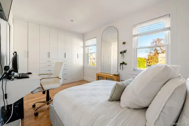 a bedroom with a bed and a desk