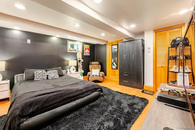 a bedroom with a bed and a large window