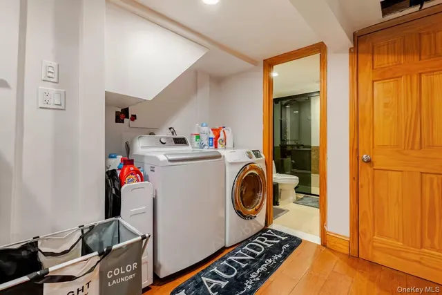 a utility room with sink dryer and washer