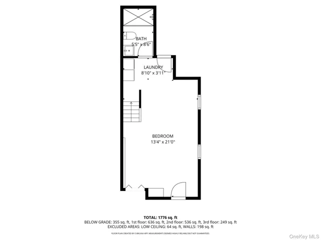 a picture of a bench in front of a wall