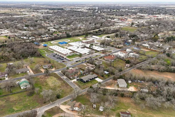 a view of a field with an trees