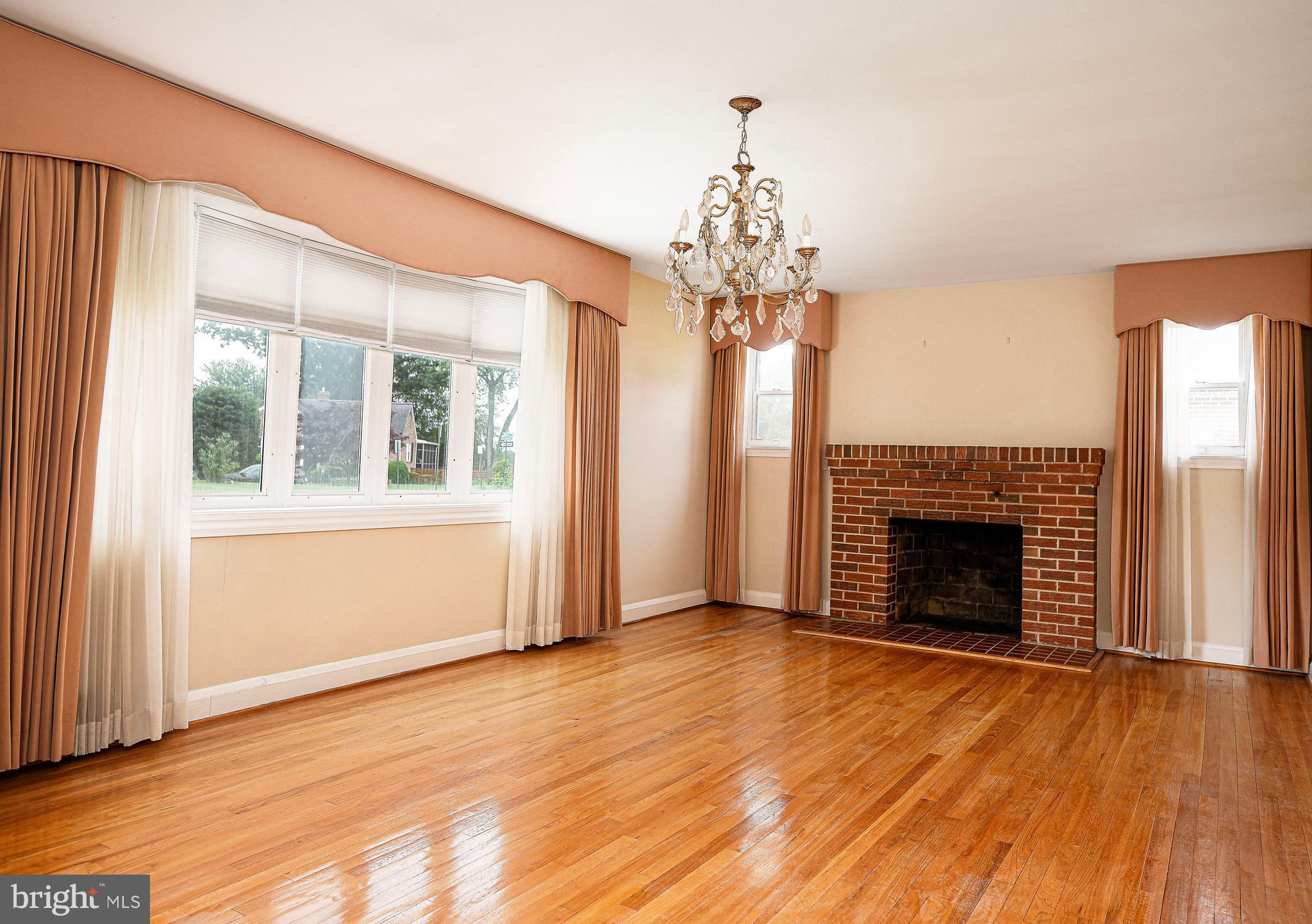 7202 Old Harford Road Baltimore, MD 21234 - Photo 3 of 21 Wood floors and wood burning fireplace