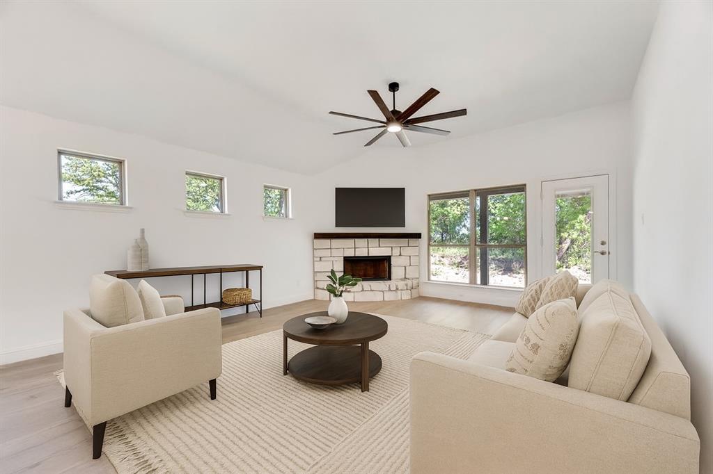 128 Loveta Lane Boyd, TX 76023 - Photo 5 of 15 a living room with furniture and a flat screen tv