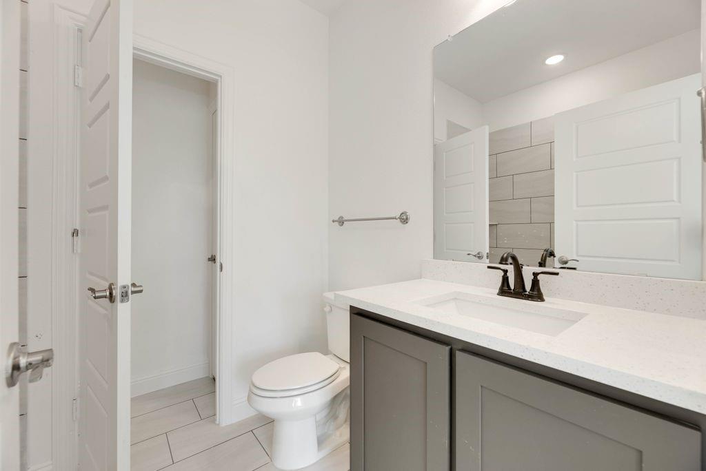 128 Loveta Lane Boyd, TX 76023 - Photo 10 of 15 a bathroom with a sink a toilet and shower