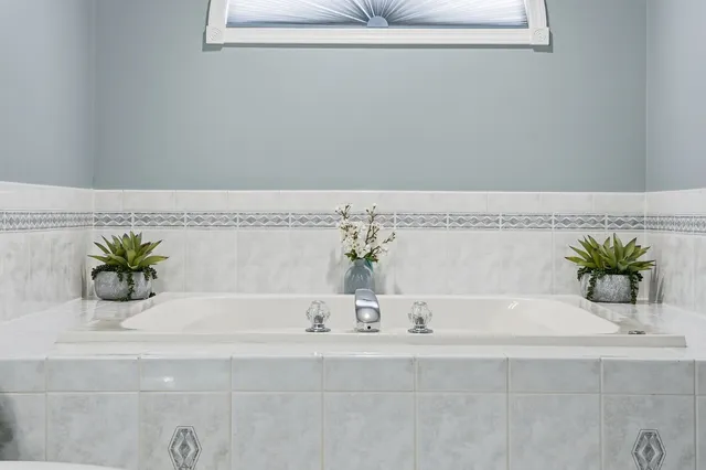 a view of a bathtub in a bathroom