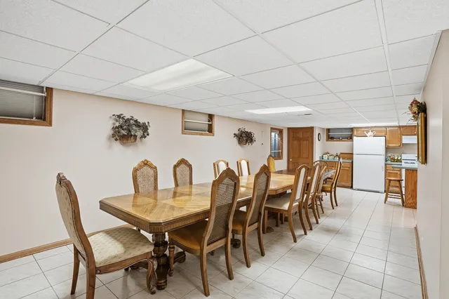 a dining room with furniture and window