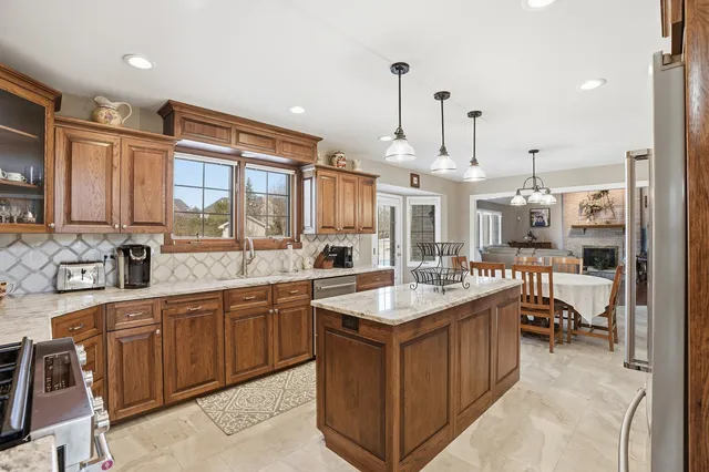 a large kitchen with lots of counter space and a sink