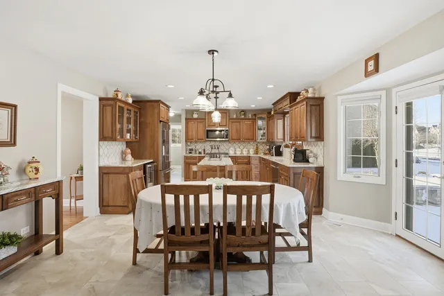 a dining room with furniture and window
